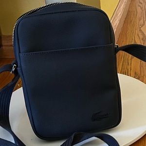Lacoste dark navy blue unisex bag perfect for traveling to carry passport, etc.